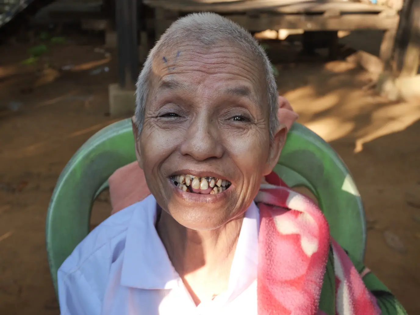 A patient smiling after receiving eye care